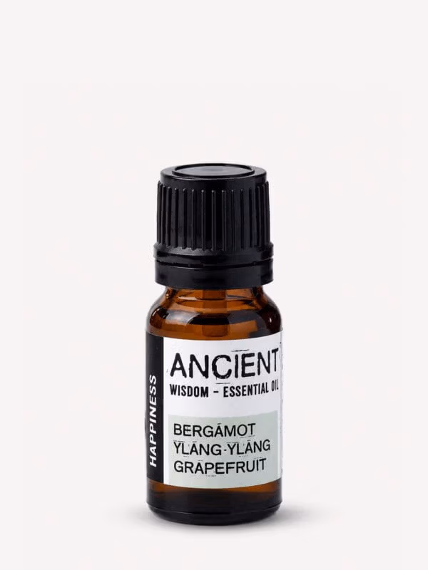 Amber bottle of Happiness essential oil blend with black cap and white label listing Bergamot, Ylang Ylang and Grapefruit.