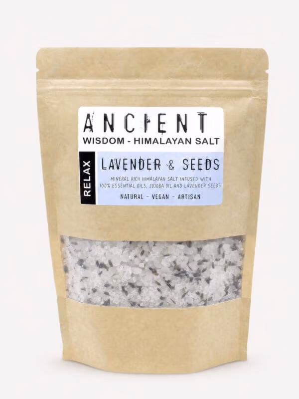 Lavender Moon Himalayan bath salts kraft pouch with clear window showing white salt crystals and lavender seeds.