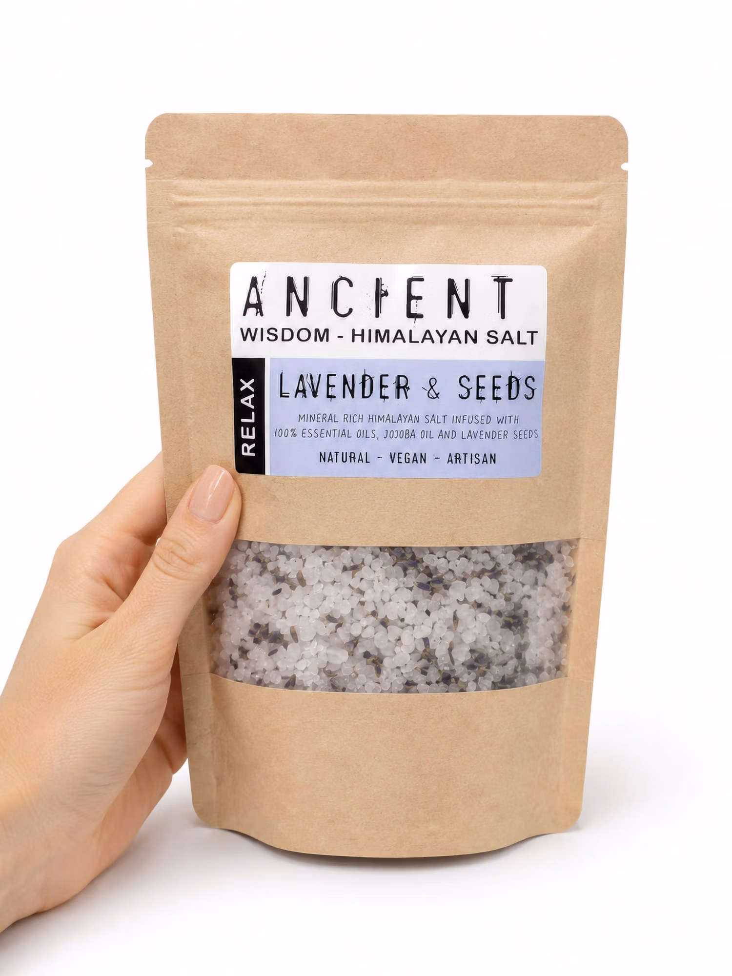Hand holding Lavender Moon Himalayan bath salts kraft pouch with clear window of salt and lavender.