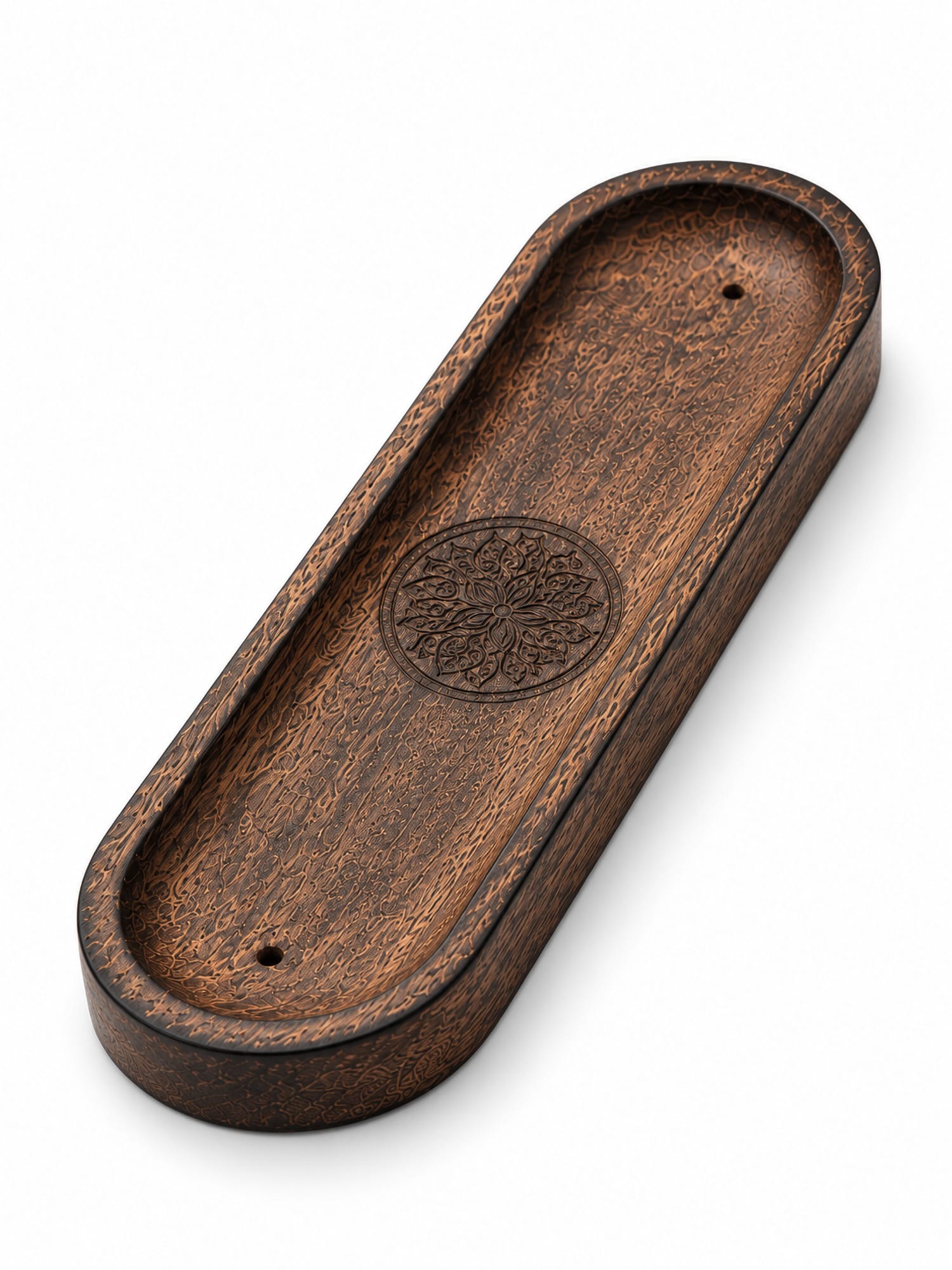 Mandala carved incense tray showing intricate design and small holes at each end.