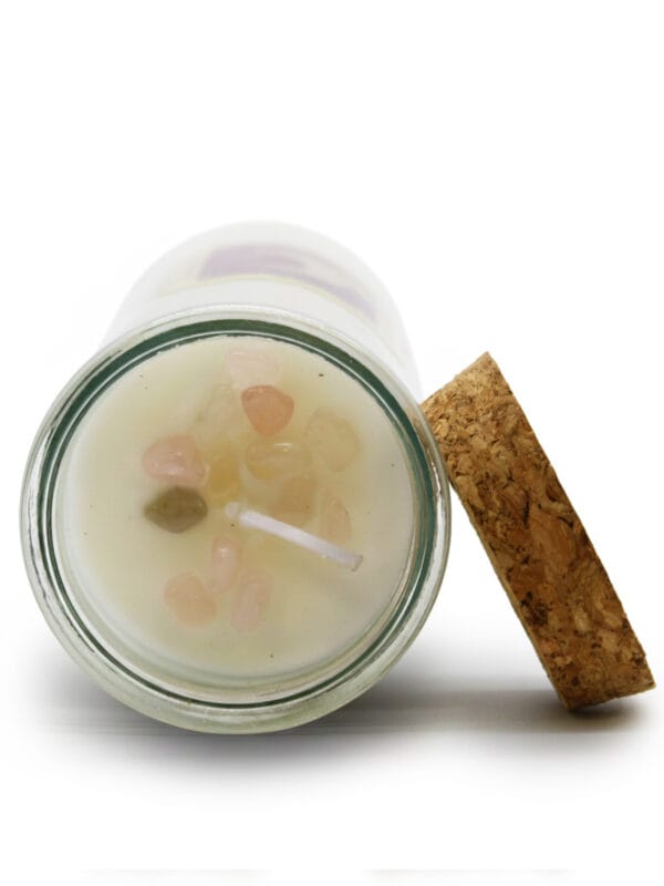 Top view of Rose Quartz & Jasmine Love Ritual Candle with rose quartz crystals around the wick.