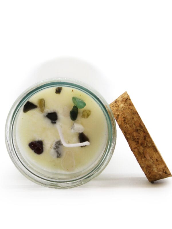 Top of Seduction & Passion Ritual Candle showing mixed gemstones in soy wax around the wick.