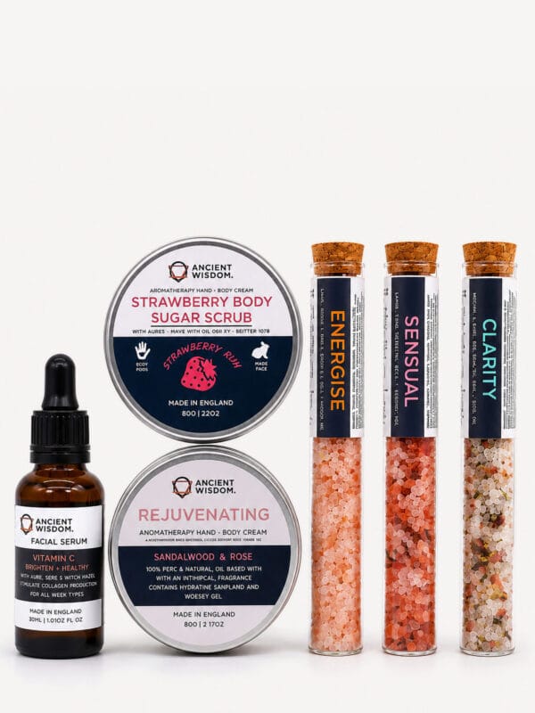 Celestial Serenity self-care kit items: two tins, a vitamin C facial serum and three test tubes of coloured bath salts.
