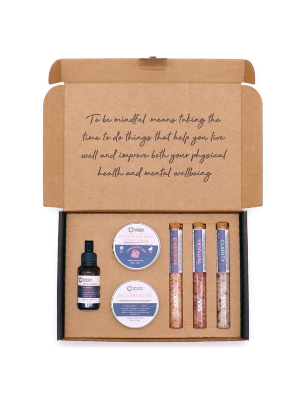 Open Celestial Serenity self-care kit box with mindfulness message and neatly arranged tins, serum and bath salts.