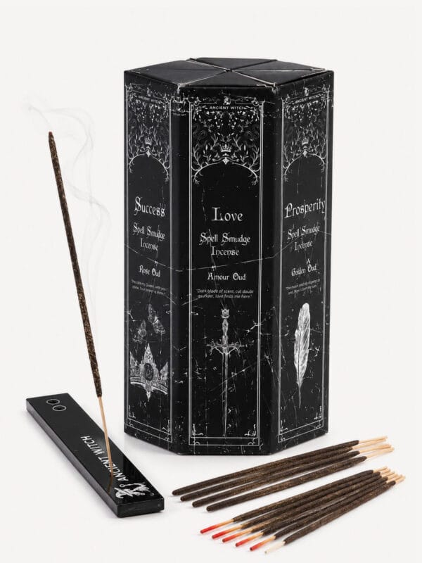 Multi-intention incense ritual set with hexagonal black tower, smoking incense stick and assorted sticks.
