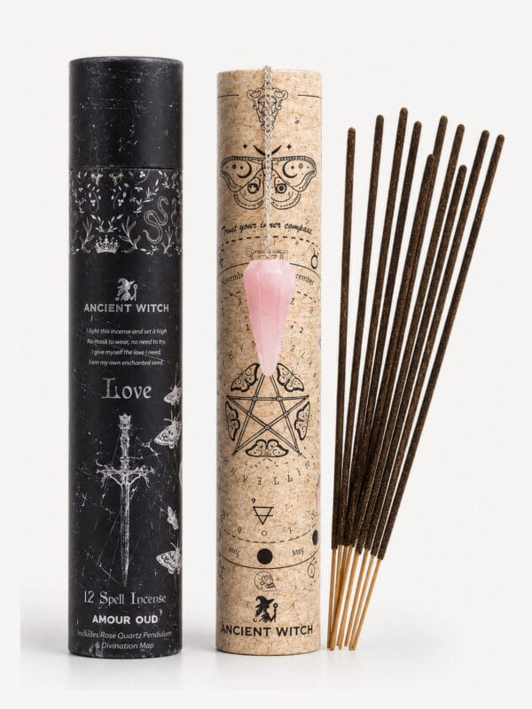 Amour Oud love incense kit with black and cork tubes, rose quartz pendulum and incense sticks.