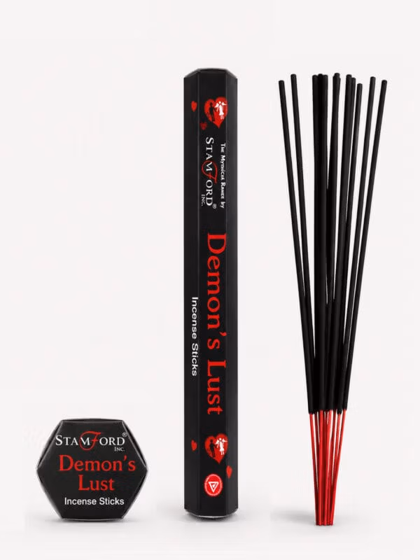 Demon's Lust incense sticks with black packaging and red-tipped sticks.