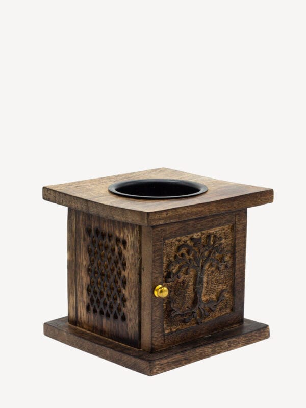 Dark mango wood Tree of Life oil burner with carved front door, lattice ventilation panel and black oil dish.