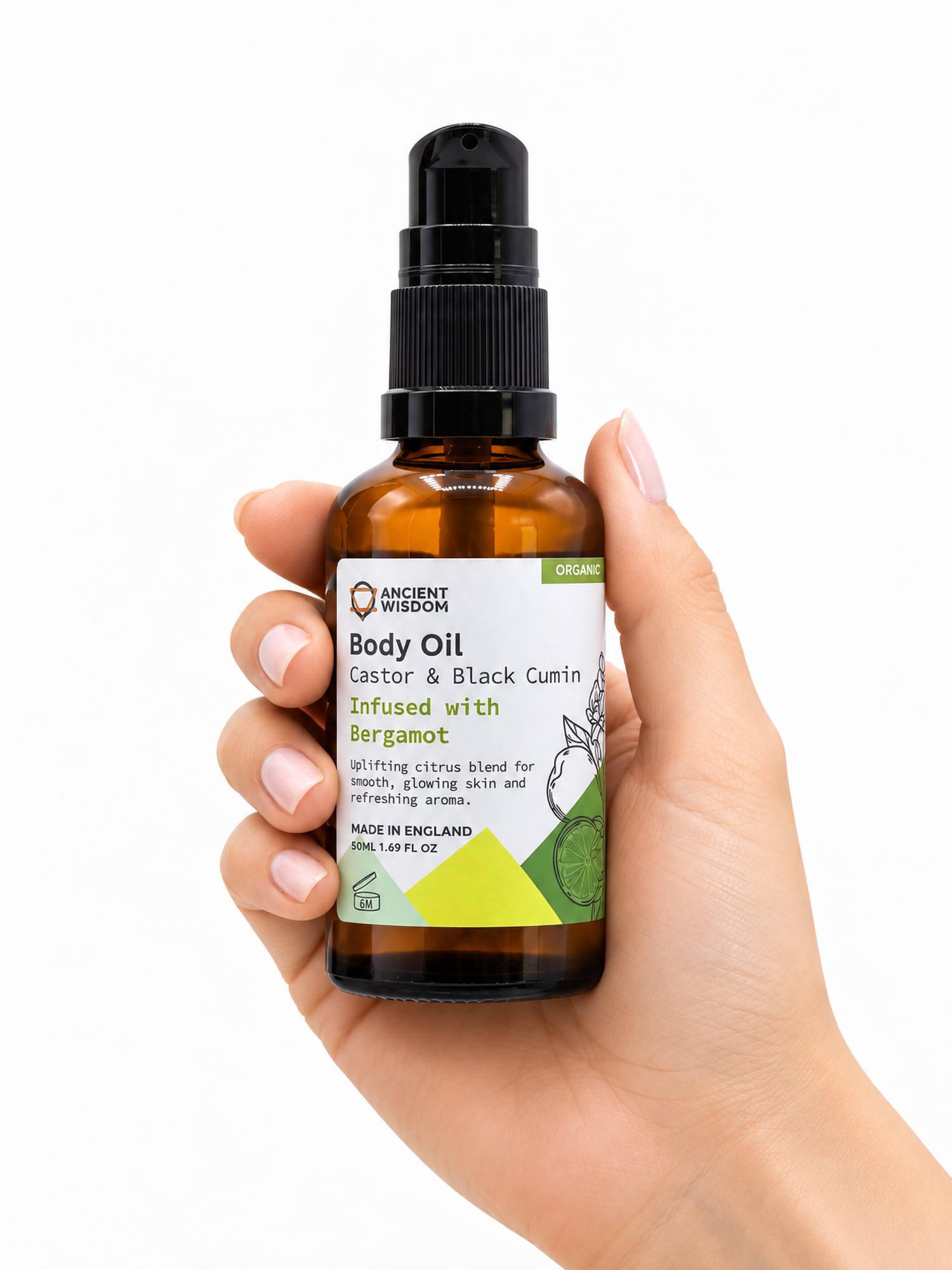 Hand holding the 50ml amber pump bottle of Ancient Wisdom Bergamot Organic Body Oil against a white background.