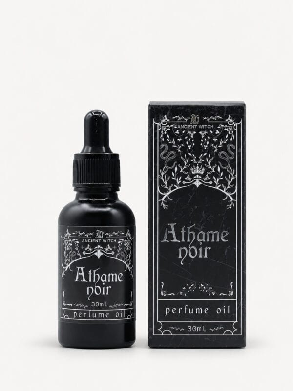 Ancient Witch Athame Noir perfume oil in a black 30ml dropper bottle beside its ornate black gift box.