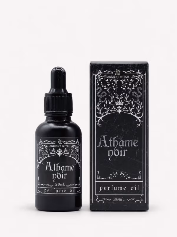 Ancient Witch Athame Noir perfume oil in a black 30ml dropper bottle beside its ornate black gift box.